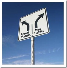 Road sign pointing to good habits and bad habits