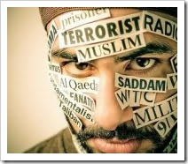 Man with muslim labels on his face