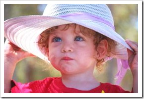 Little boy in women's hat