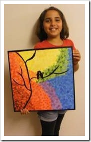 Girl holding a painting