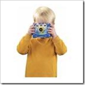 Little boy taking a picture