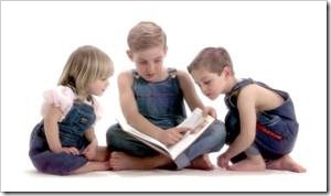 3 little children reading a book