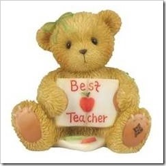 Teddy with a sign saying "best teacher"