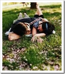 Couple lying in the grass