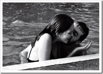 Couple kissing in a pool