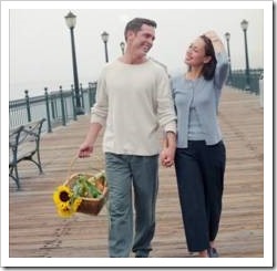 Couple walking along a pier