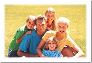 A family in a field of grass