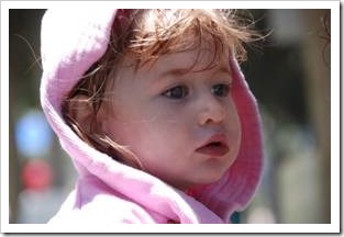 Little girl in a pink hoodie