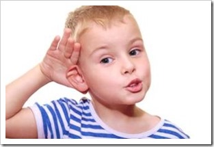 Little boy cocking an ear to listen