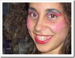 Teenager covered in stage make-up smiling into the camera