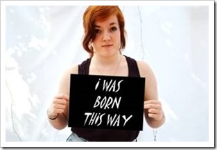 Girl holding sign saying I Was Born This Way