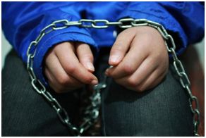 Child's hands in chains. Teaching kids obedience is like emotional chaining