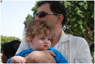 Dad with little boy on his lap