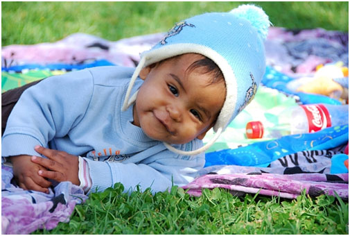 Baby on a picnic blanket