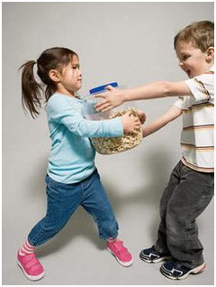 Children fighting over a jar