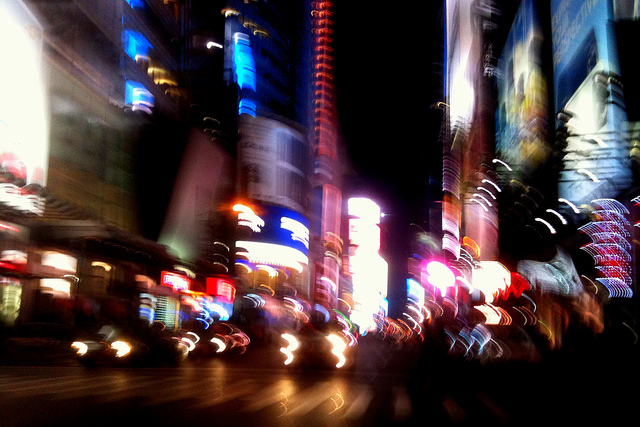 Blurred city street at night captured in movement