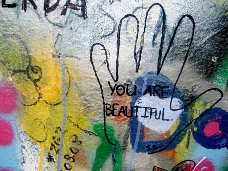Drawing of hand with the words You Are Beautiful