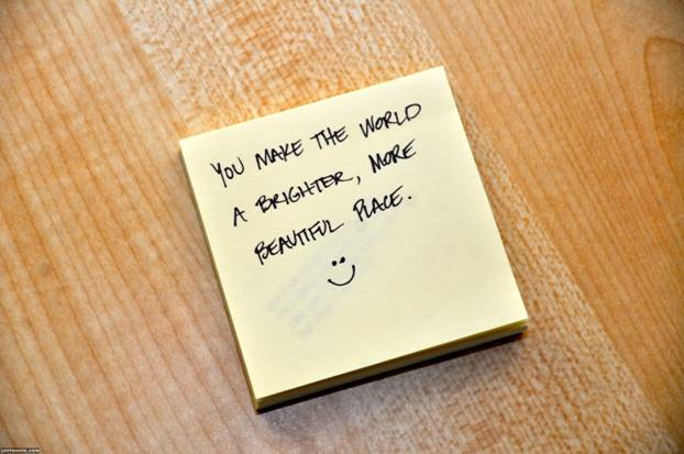 Post it note with "You make the world a brighter, more beautiful place"