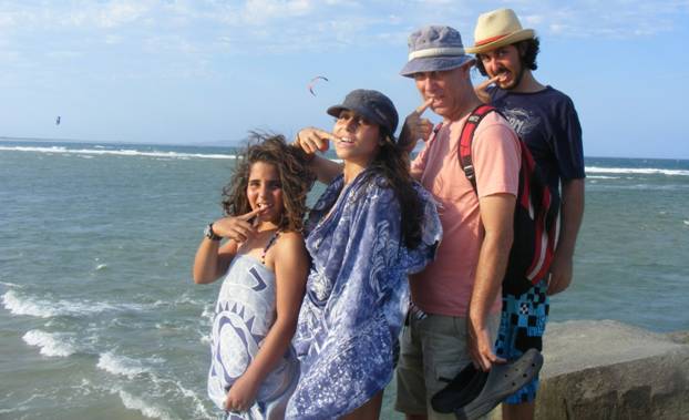 The Baras family in a funny pose on the beach