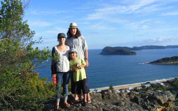 Our kids on a hill overlooking a bay