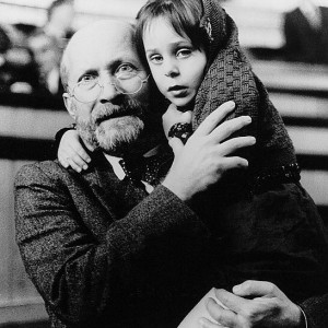 Janusz Korczak holding a child