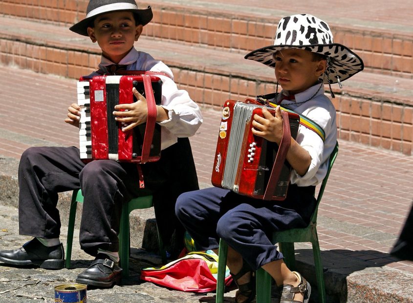 2 your boys playing accordion on the street