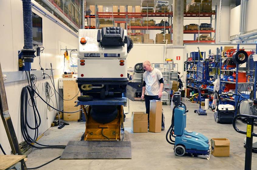 Teenage boy in a machine workshop