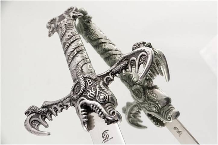 Sword with dragon hilt reflected in the mirror