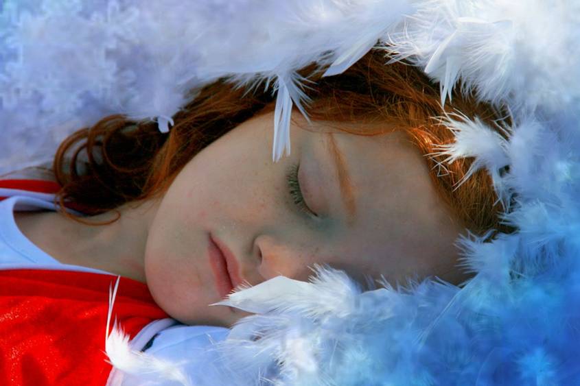 Girl sleeping on feathers