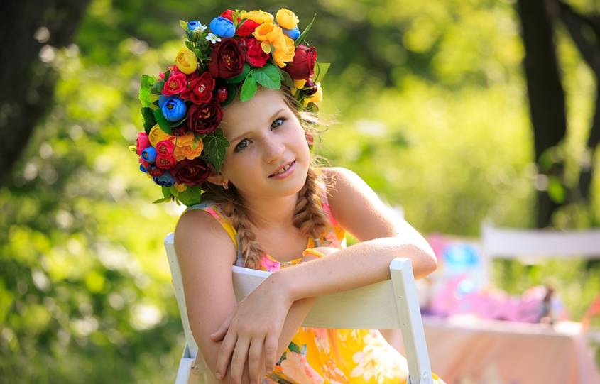 Girl with a crown of flowers on her head