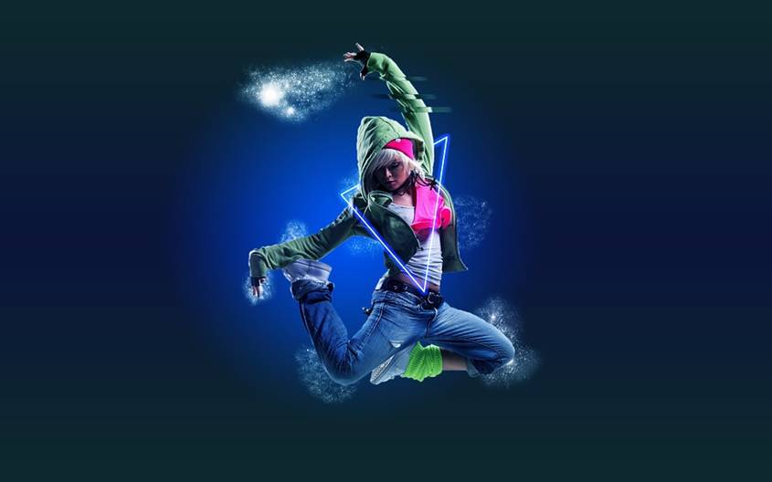 Teen girl jumping in the air in hip-hop outfit