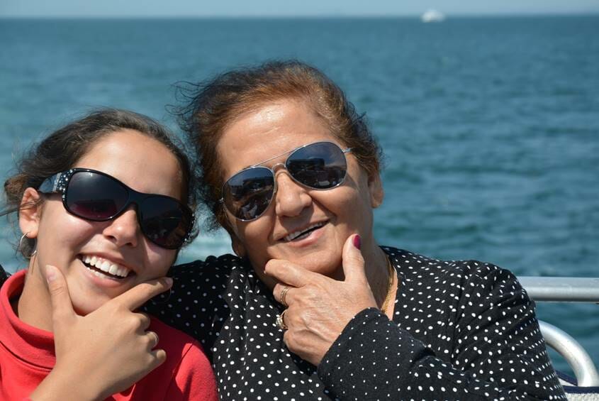 Grandmother and granddaughter making a cool face