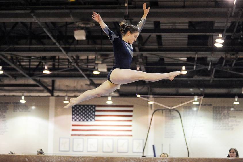 Gymnast jumping high in the air