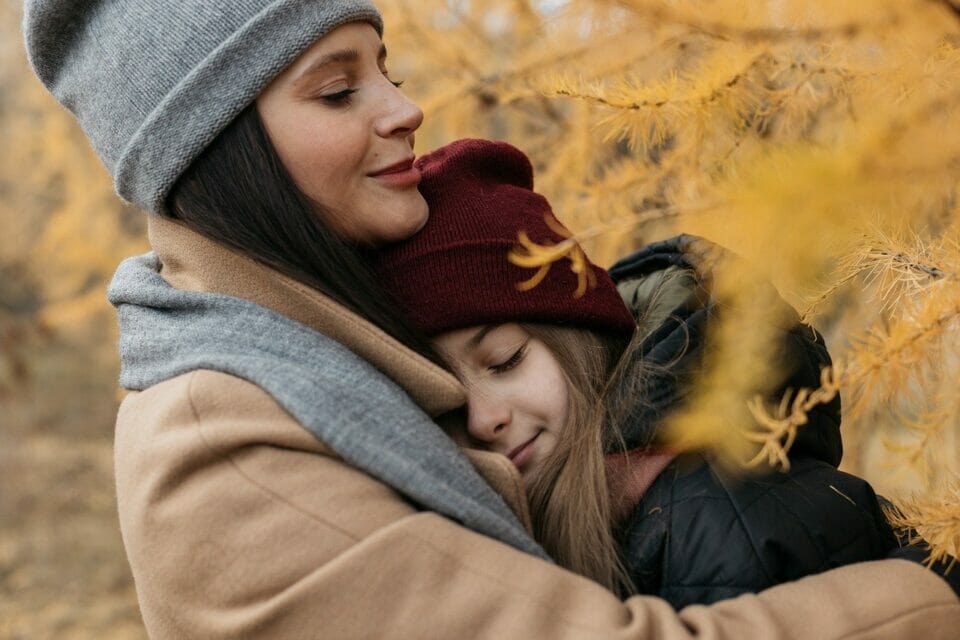 Mother showing empathy to her daughter with a hug