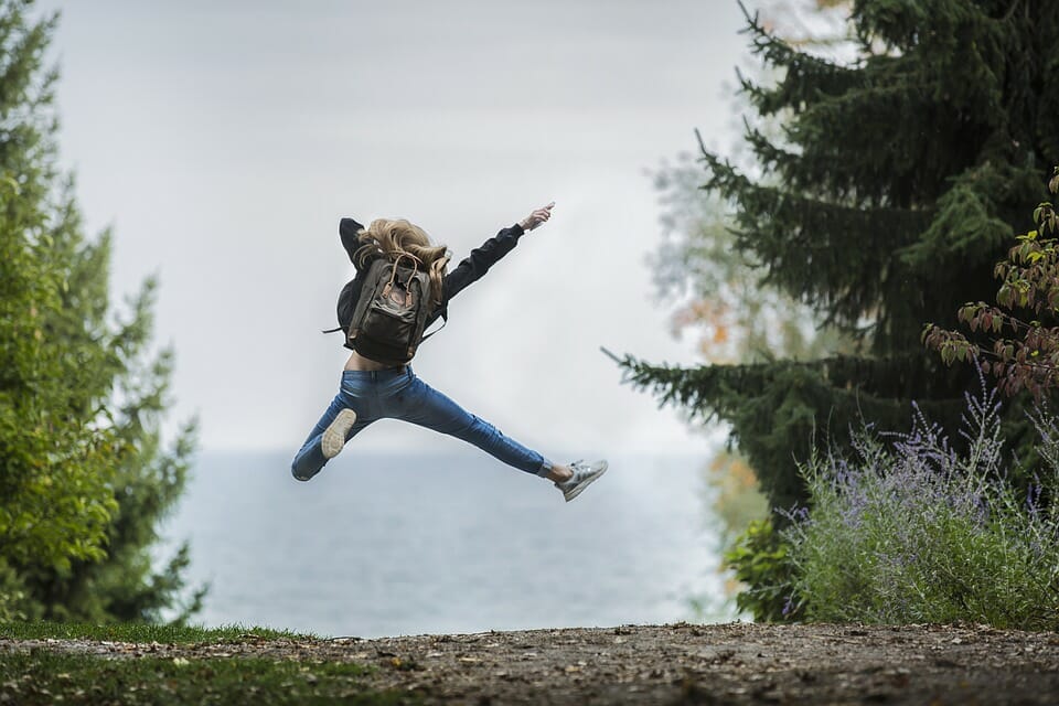 Young woman jumping for joy