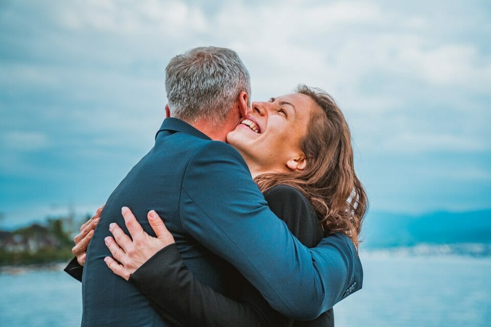 Man and woman embracing happily