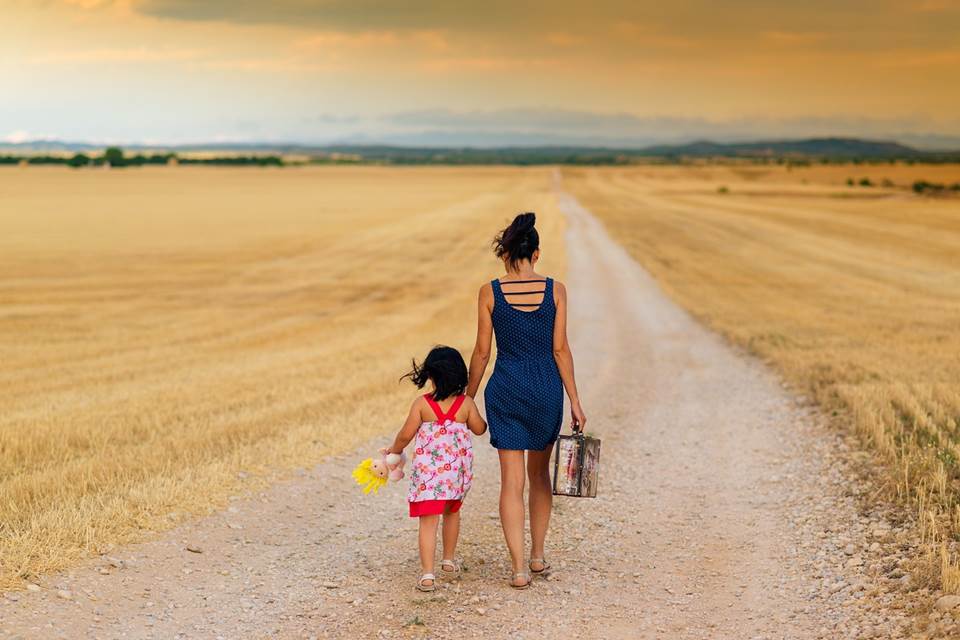 Mother and daughter on a country dirt road