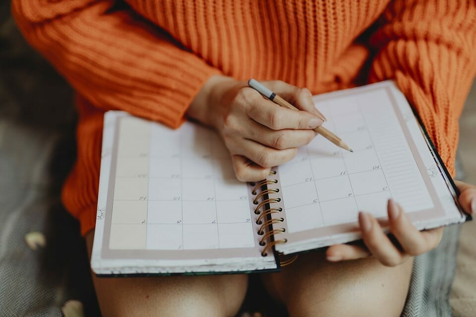 Woman writing in diary