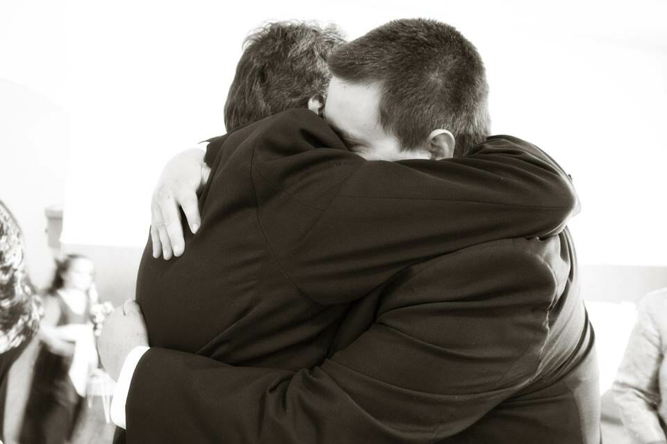 Two people hugging deeply