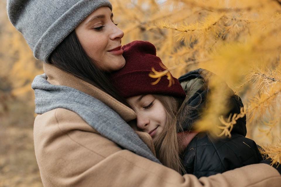 Mother and daughter embracing after venting negative emotions