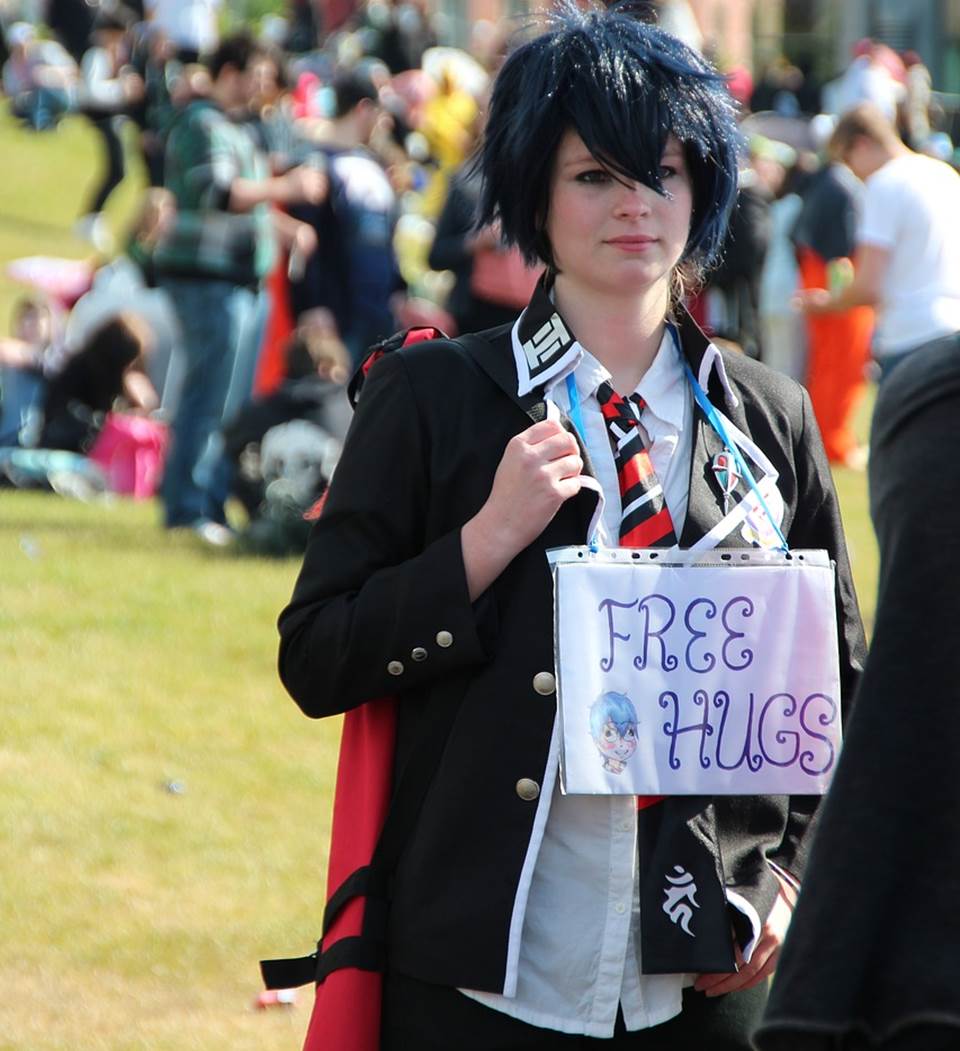 Student with a Free Hugs sign