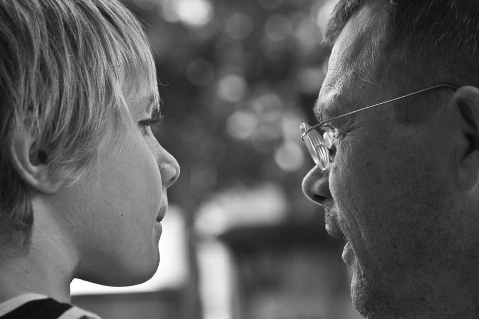 Father and son in close conversation