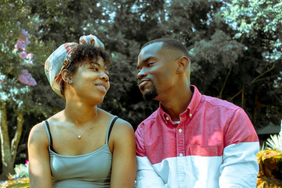 Couple sitting staring lovingly at each other