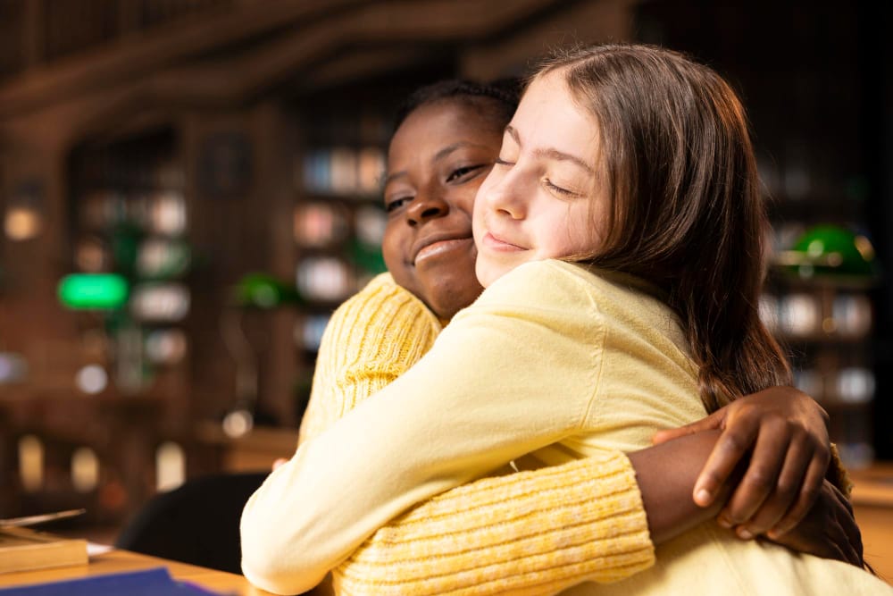 2 girls hugging - empathy definition for kids