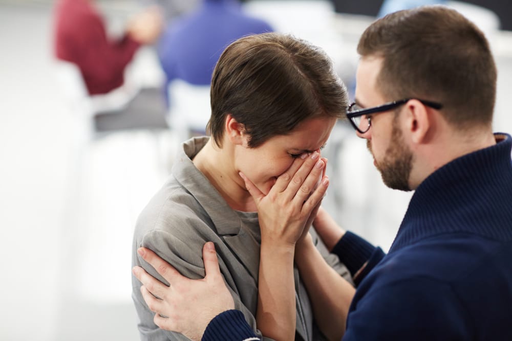 Man showing empathy towards crying woman
