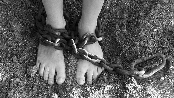 Child with chains in legs as punishment