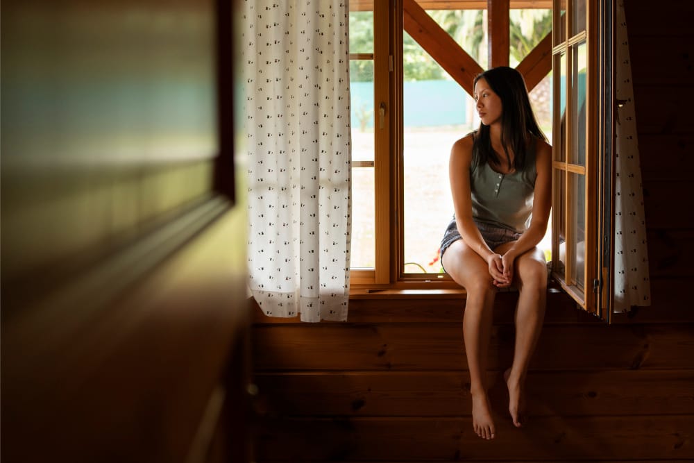 Fear of silence psychology: woman sitting in a quiet moment of reflection