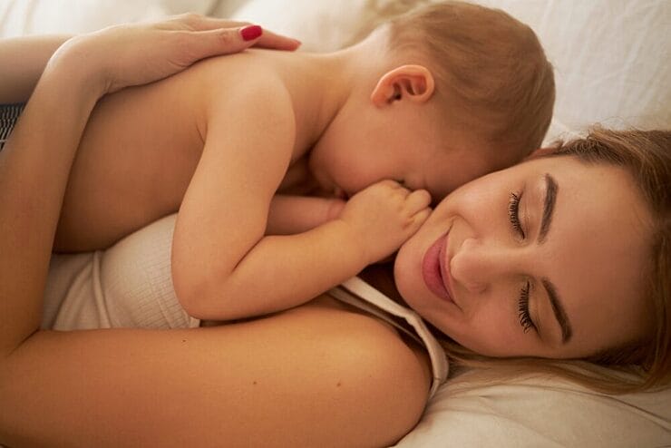 co-sleeping safety parent and child sleeping together peacefully