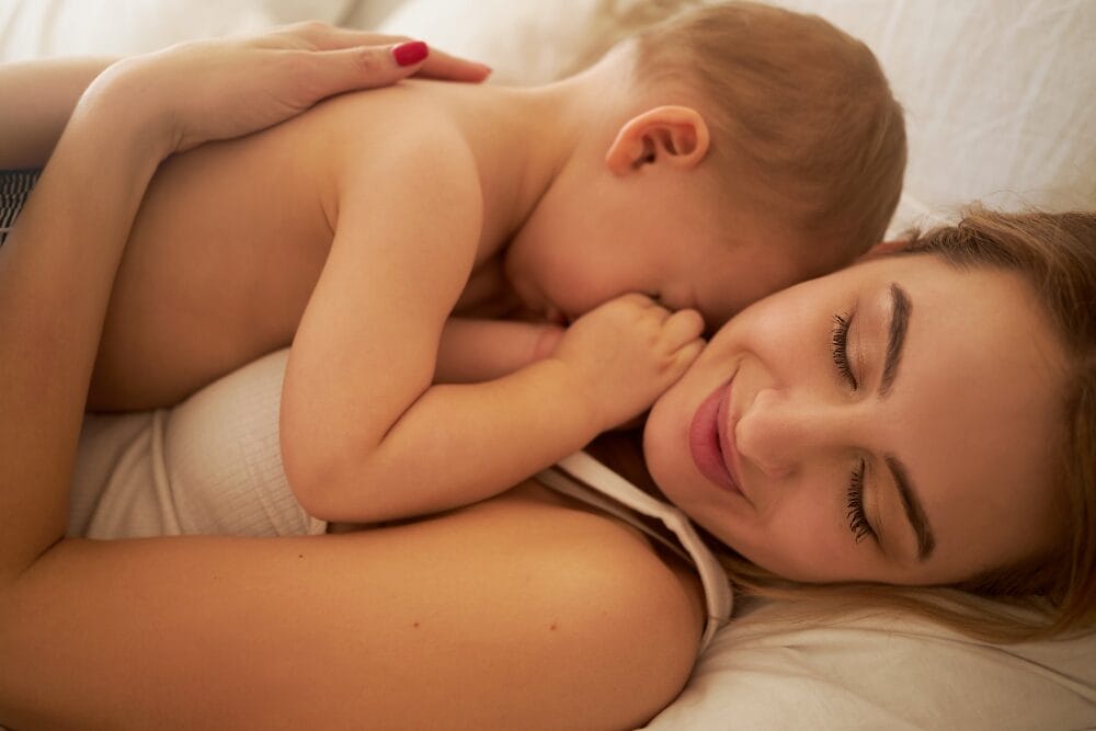 co-sleeping safety parent and child sleeping together peacefully
