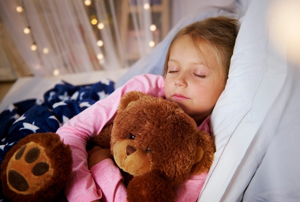 child sleeping independently demonstrating co-sleeping safety alternative